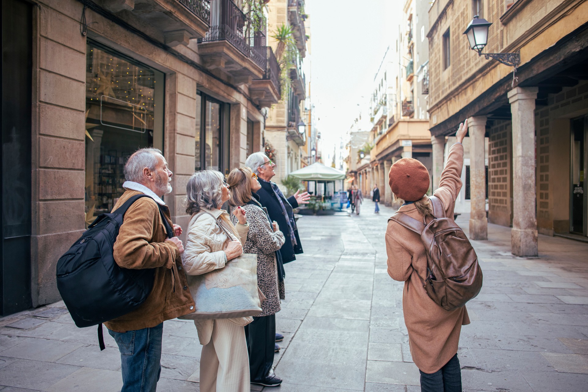 Senior friends with a tour guide at the city